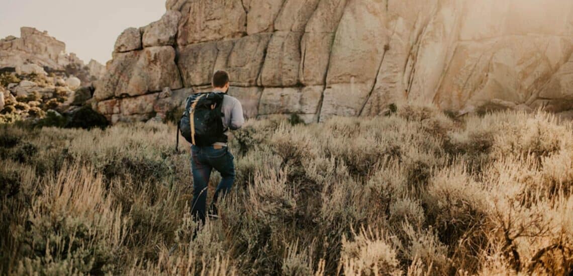 Man hiking in rocky mountains