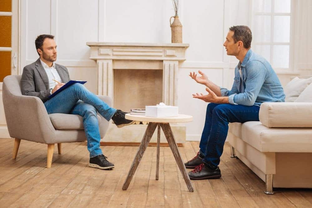 Man sitting with a therapies
